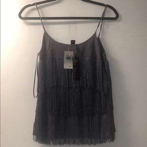 Strapped Too with fringes.